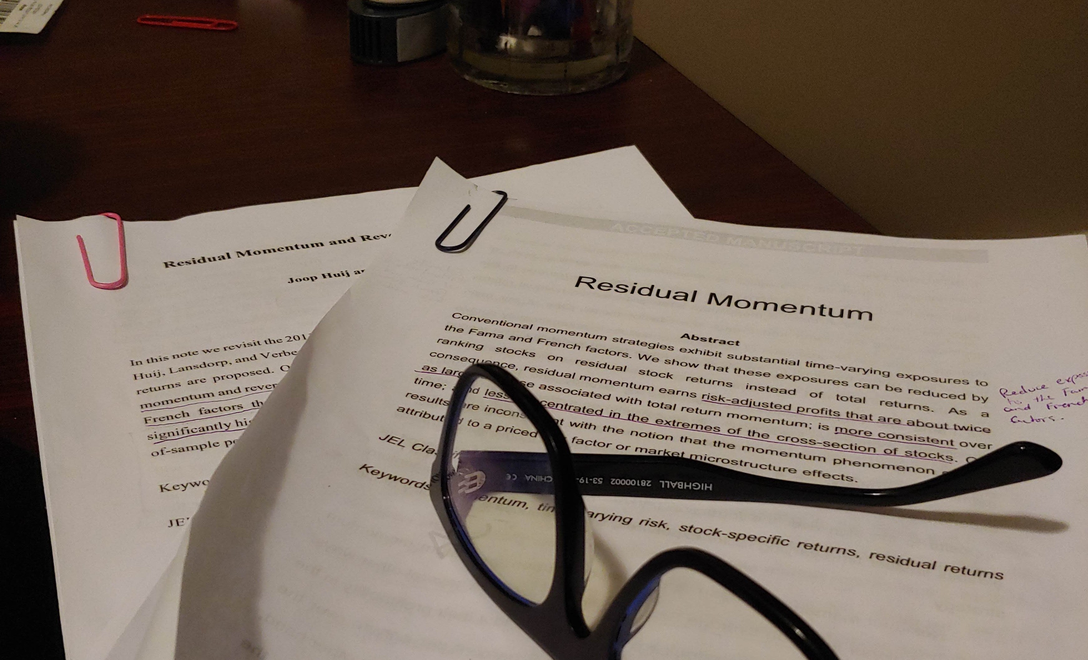 Residual Momentum research paper with glasses on top